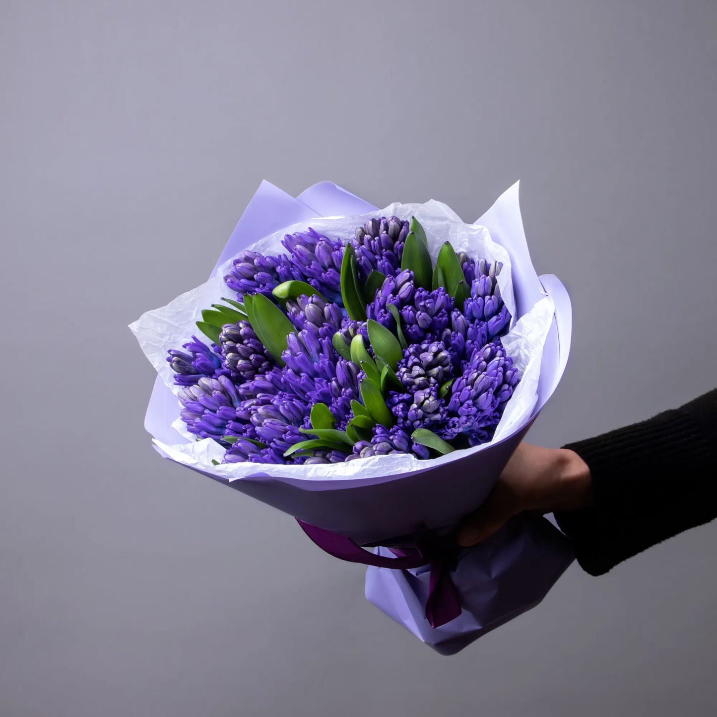 Bouquet of 24 blue hyacinths with greenery