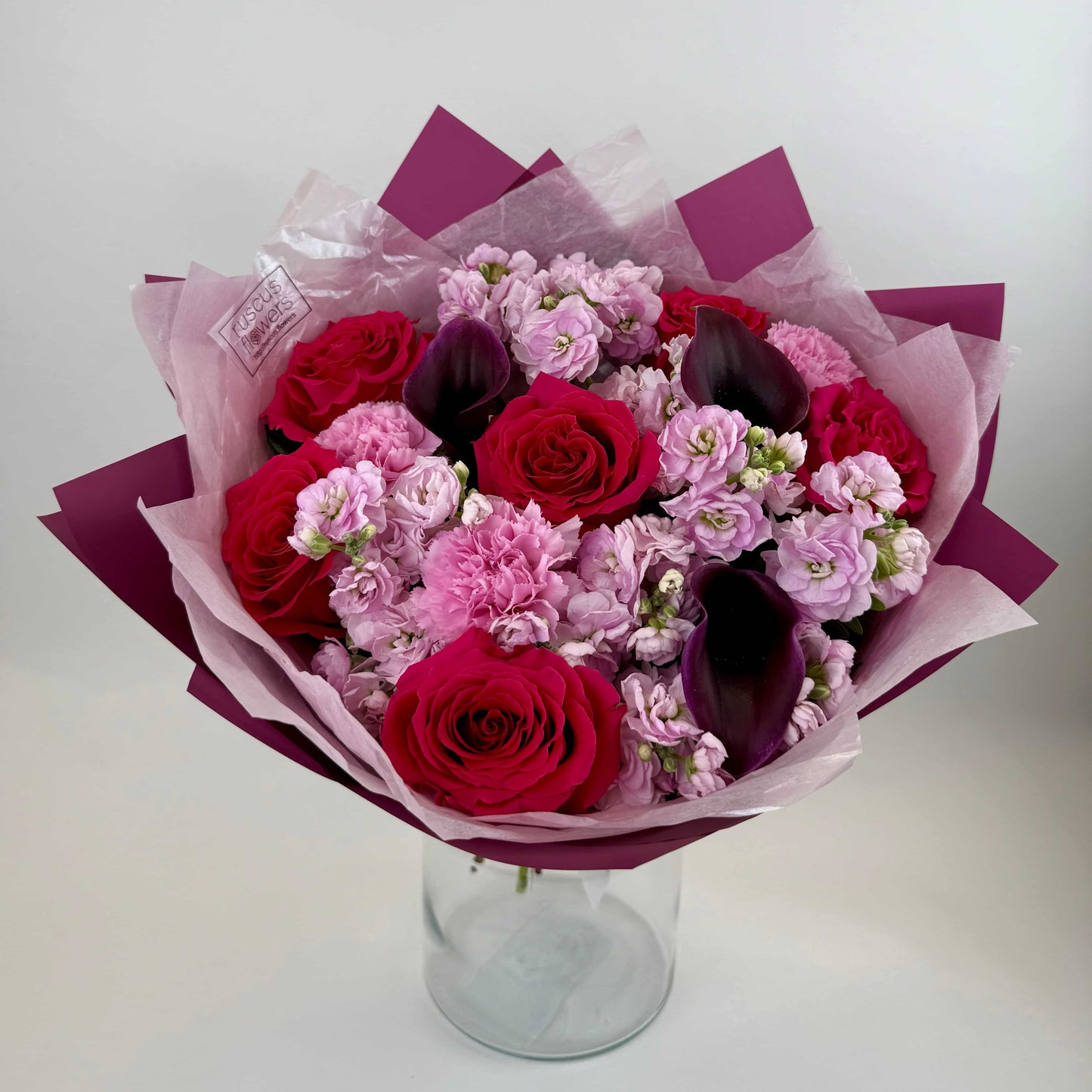Mixed bouquet with roses, calla lilies, carnations and stock