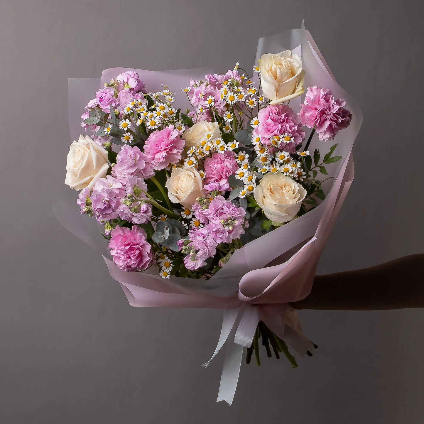Bouquet with cream roses, stock, chamomile, and pink carnations