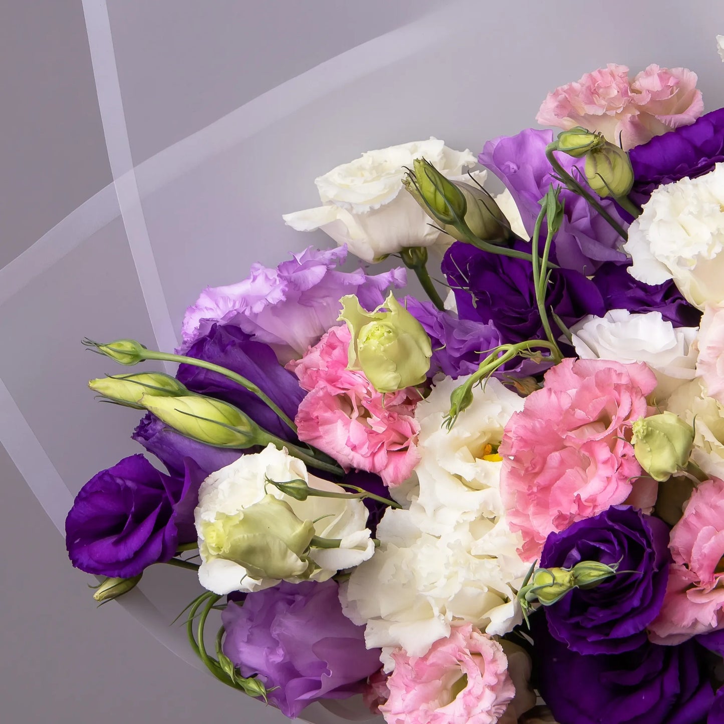 Close-up of colorful lisianthus blooms in soft, elegant bouquet