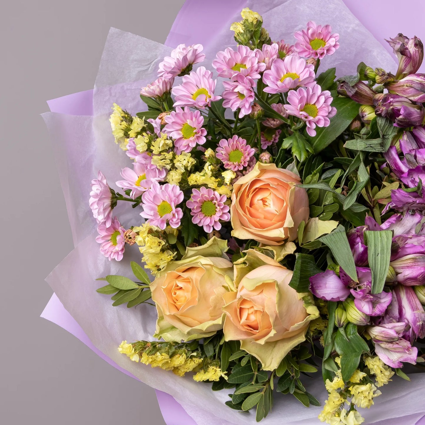 Close-up of roses and alstroemeria in fresh mixed bouquet