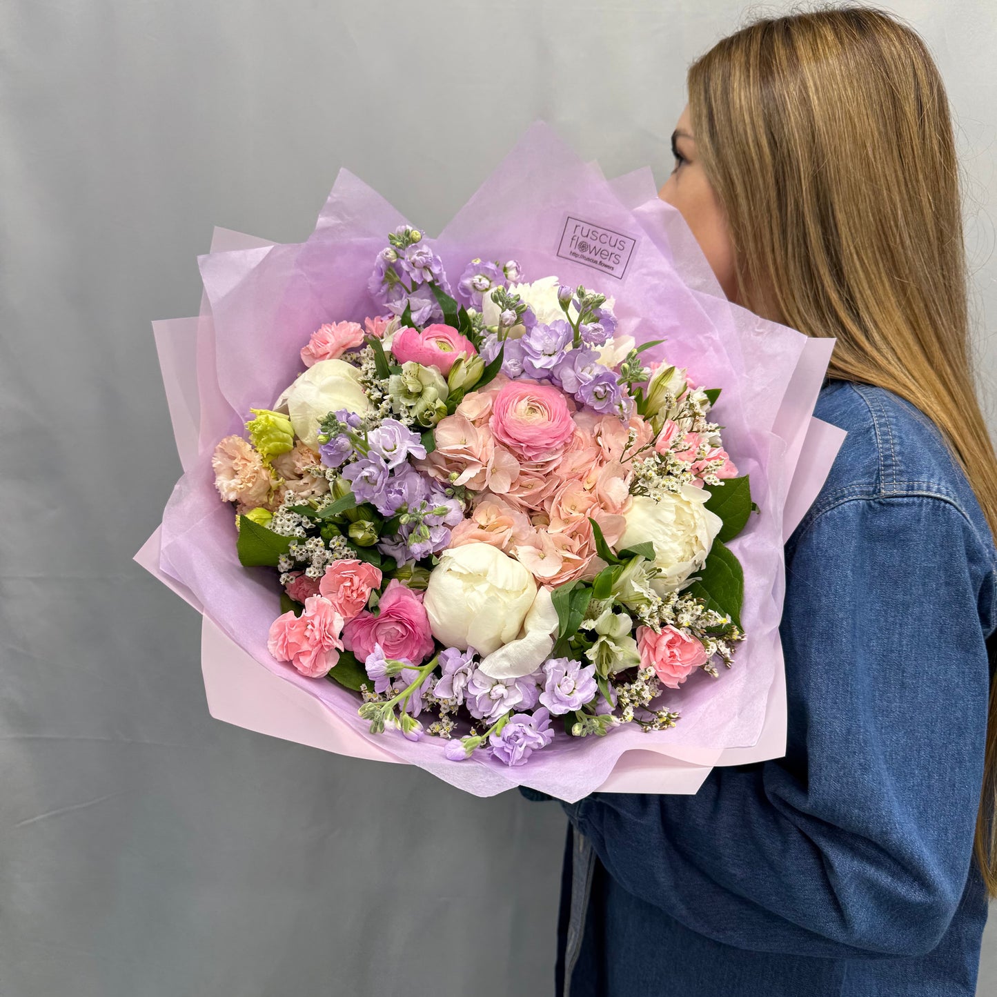 Soft pastel bouquet with peonies, ranunculus, hydrangeas, and more