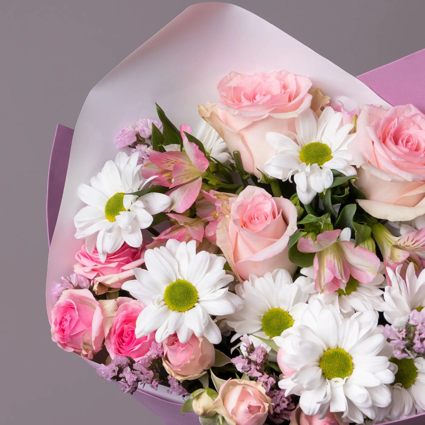 Close-up of gentle mixed flowers in compliment bouquet