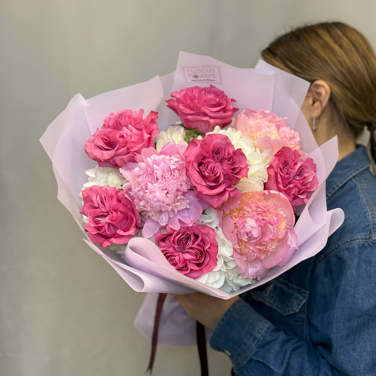 Blush peonies, hydrangeas, and garden roses with soft greenery