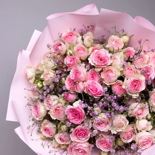 Close-up of spray roses and gypsophila in soft pastel bouquet