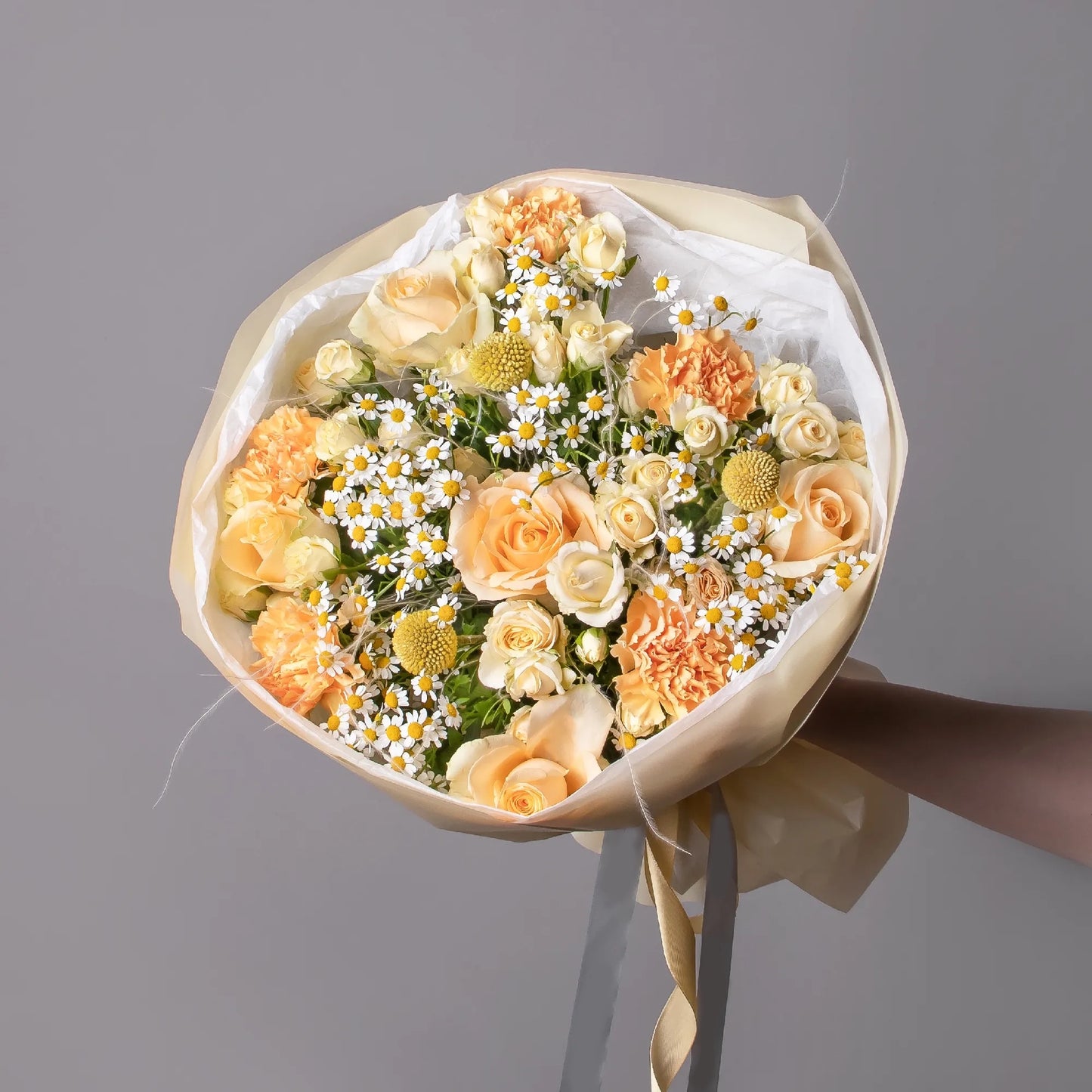 Bouquet with roses, chamomile, spray roses, and carnations
