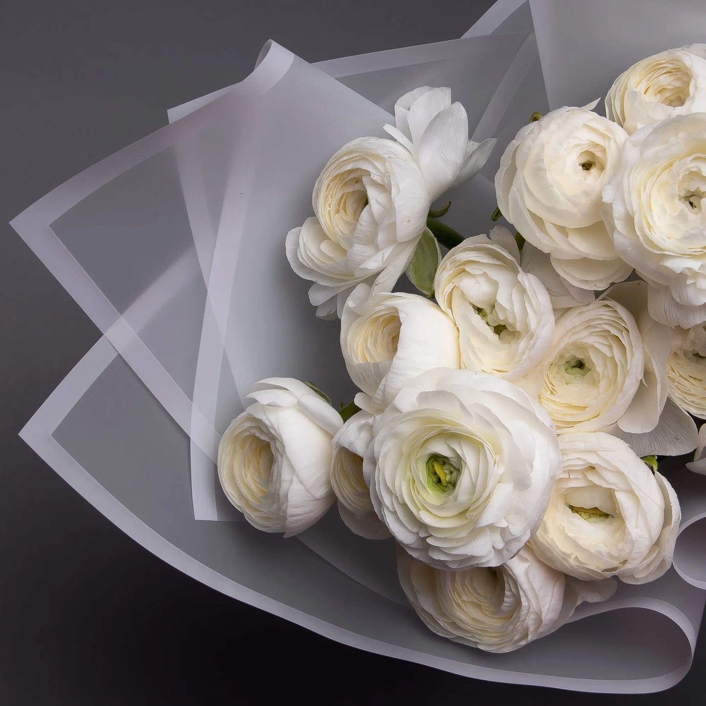 Close-up of white ranunculus blooms in elegant bouquet