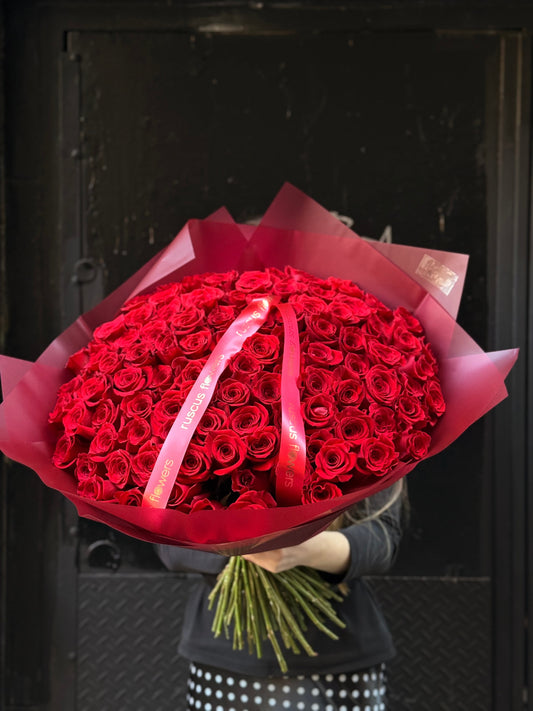 Classic bouquet of 100 red roses in lush wrapping