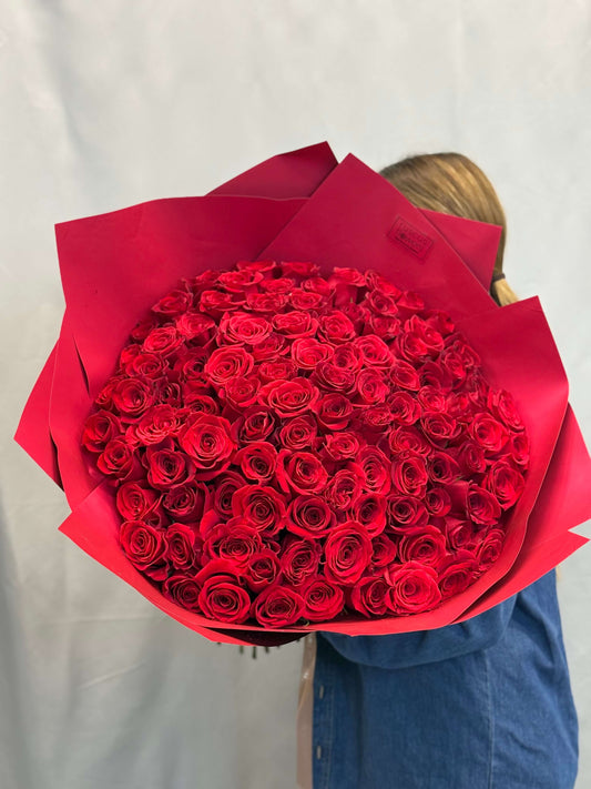 100 red roses arranged for delivery