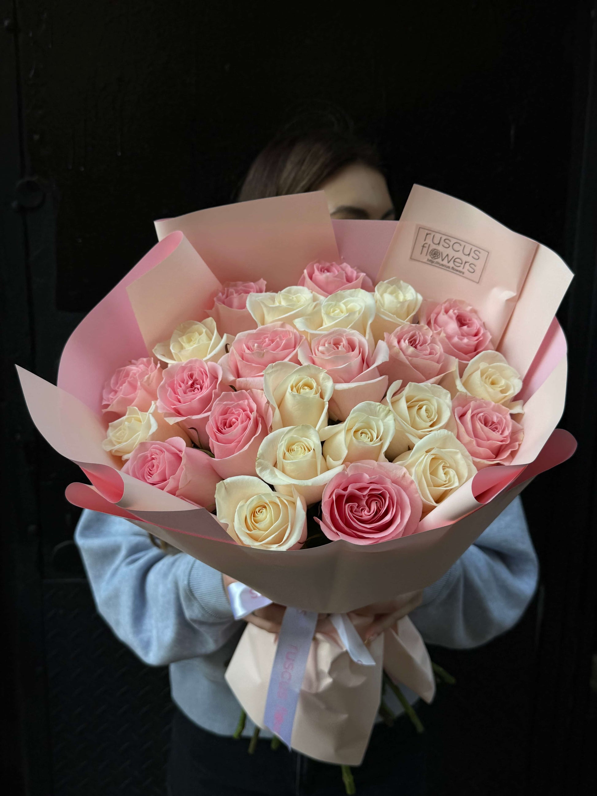 Bouquet of 24 roses wrapped in elegant paper
