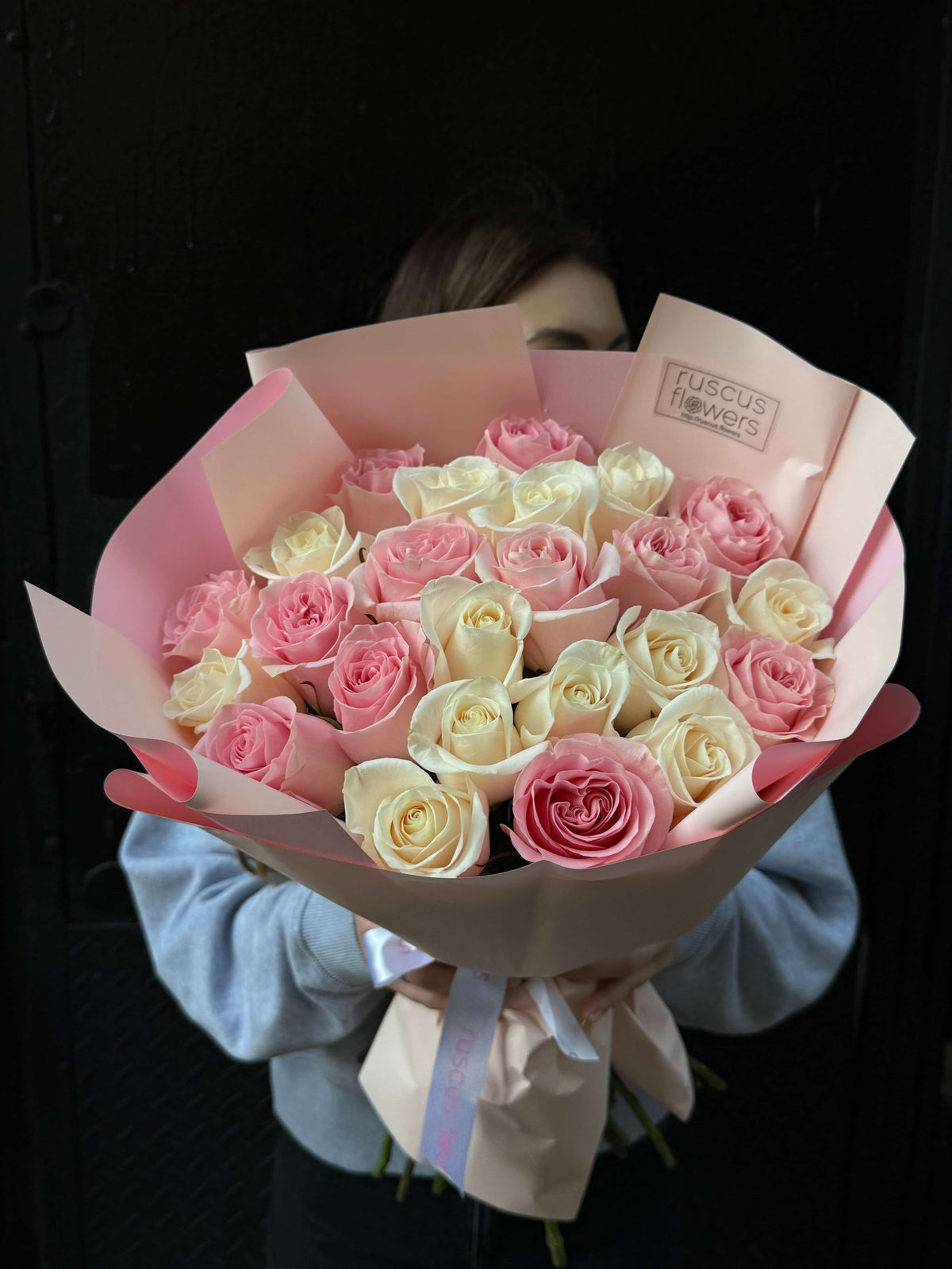 Bouquet of 24 roses wrapped in elegant paper