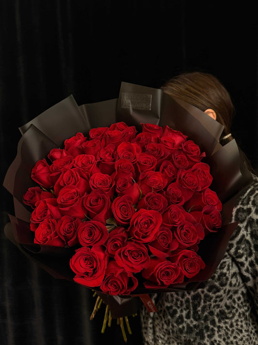 50 red roses in black wrapping