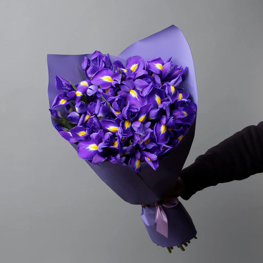 Bouquet of 27 blue irises with greenery