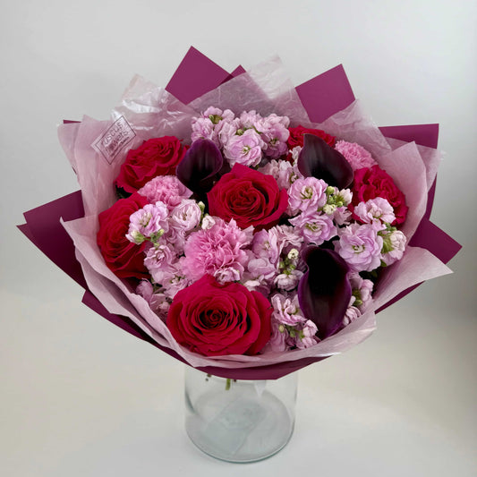 Mixed bouquet with roses, calla lilies, carnations and stock