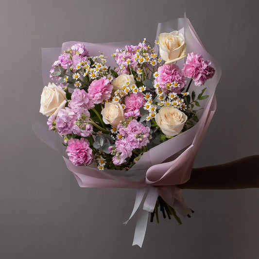 Bouquet with cream roses, stock, chamomile, and pink carnations