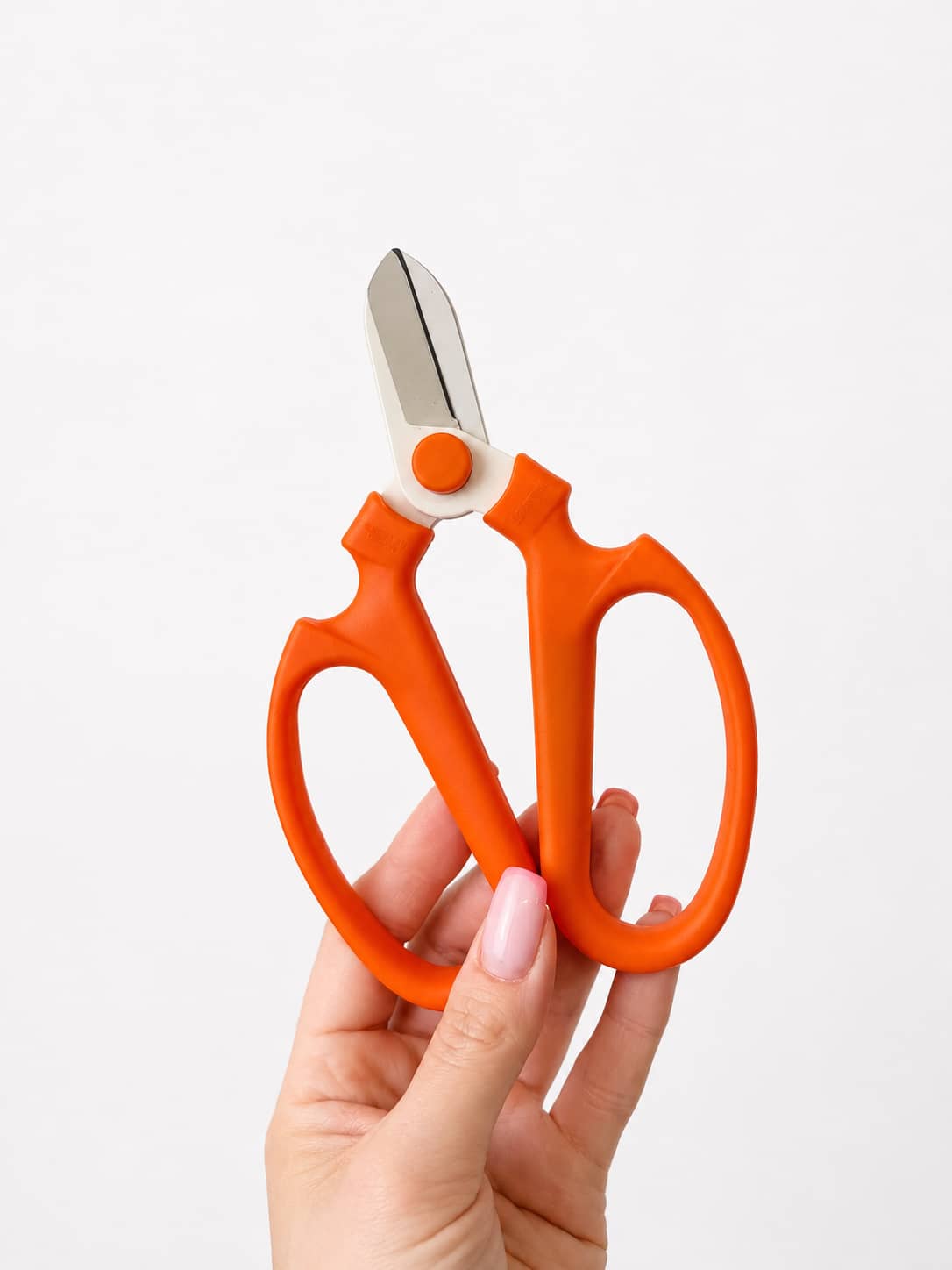 Orange floral shears for trimming fresh flower stems