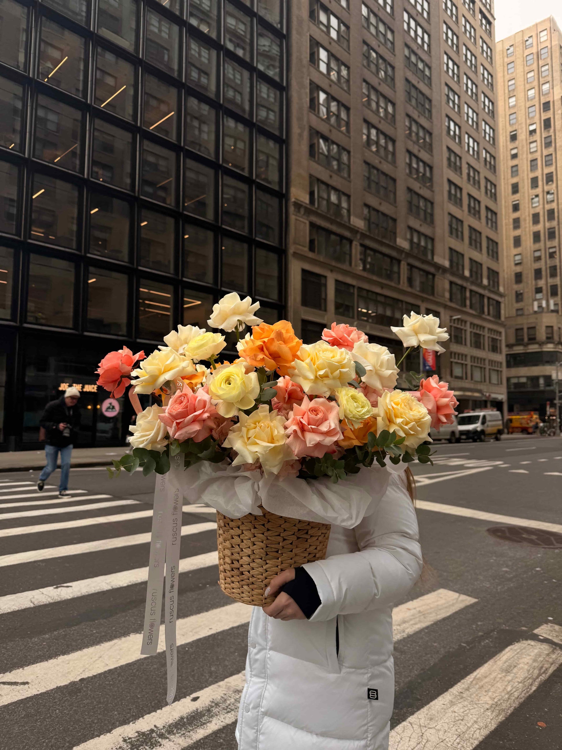 Floral basket with French roses and ranunculus