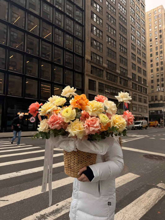 Floral basket with French roses and ranunculus