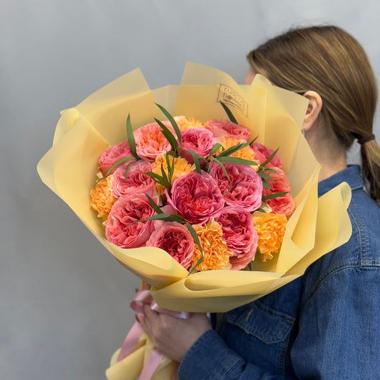 Mixed bouquet of garden roses, carnations, and eucalyptus