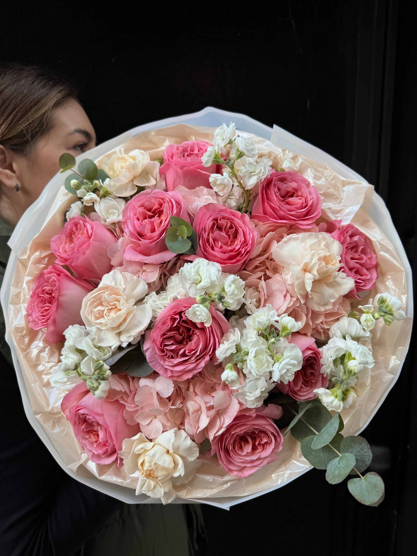 Bouquet of soft garden roses with seasonal greens