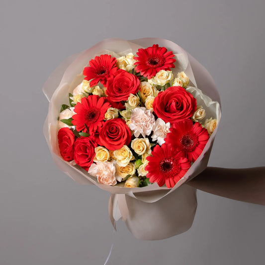 Bouquet with gerbera mini, roses, spray roses, and carnations