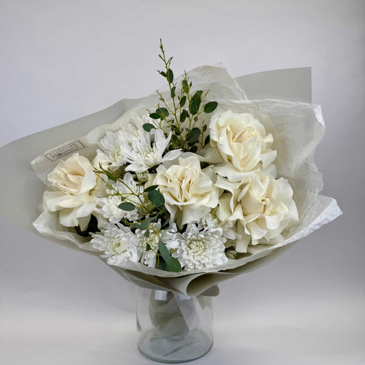 Light bouquet with roses, spray chrysanthemums and eucalyptus