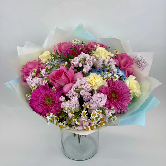 Light bouquet with roses, hydrangeas, gerbera, stock, and tanacetum