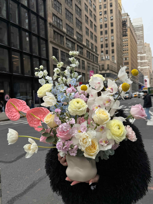 Luxury vase arrangement with anthurium, roses and orchid in modern style