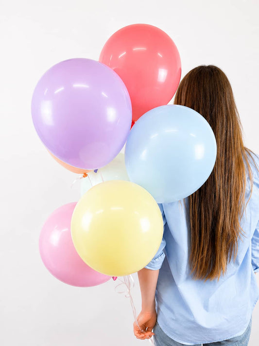 Colorful pastel balloons in pink, lavender, blue and yellow
