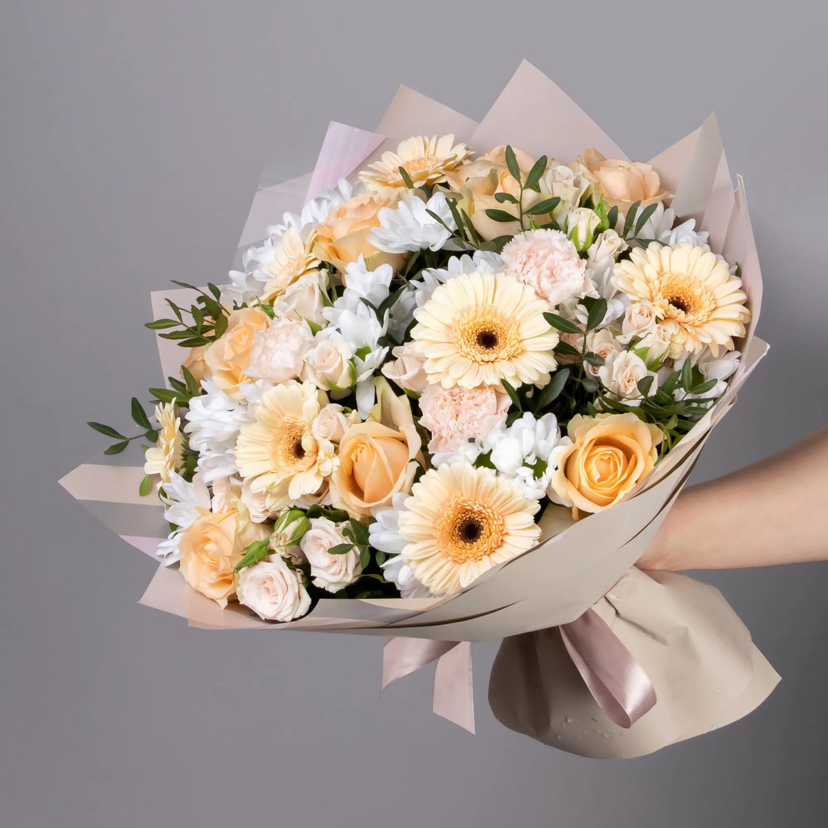 Peach bouquet with roses, gerbera, spray roses, carnations, and chrysanthemums