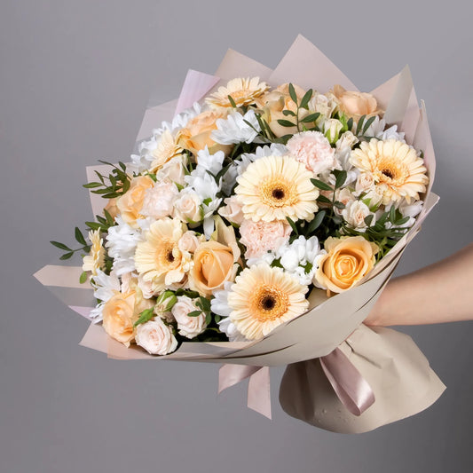 Peach bouquet with roses, gerbera, spray roses, carnations, and chrysanthemums