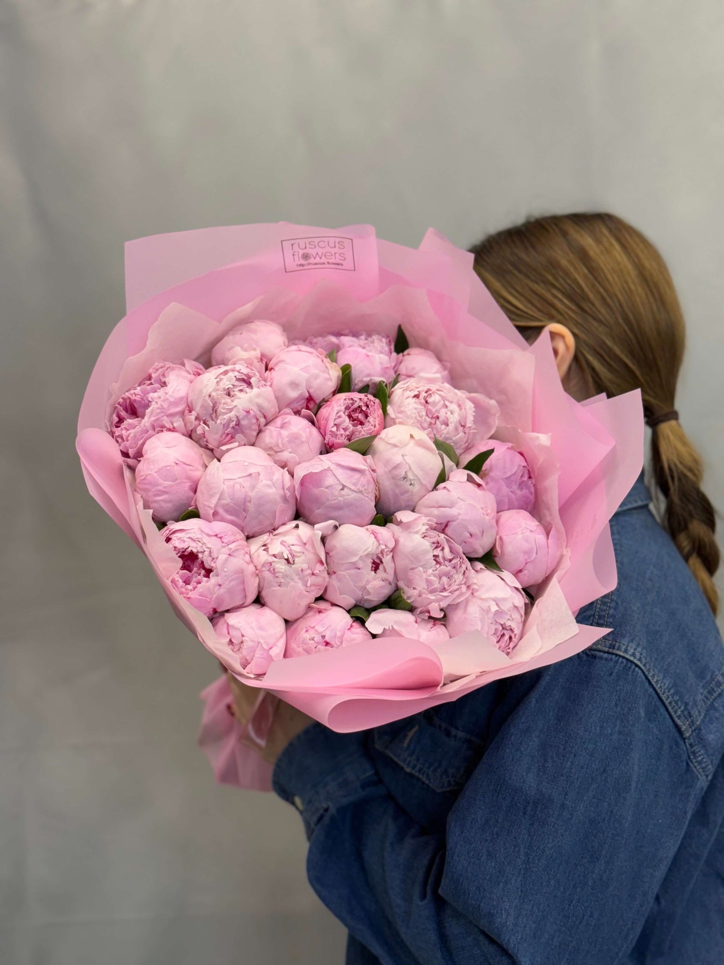 Soft pink peonies in light wrapping