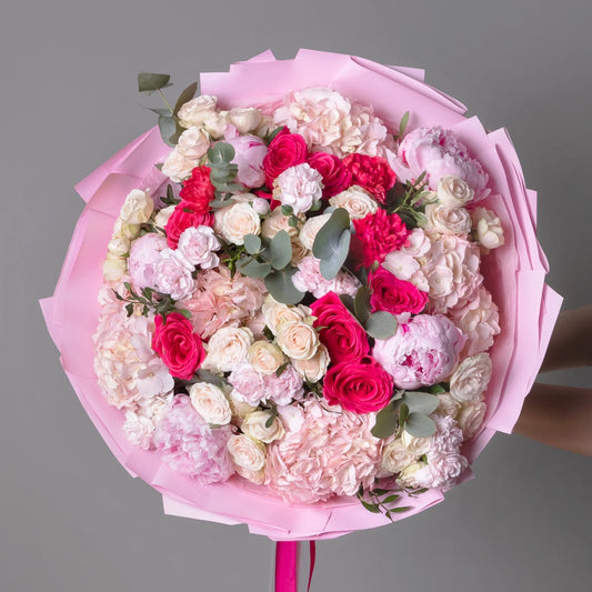 Bouquet with peonies, roses, hydrangeas, carnations, and greenery