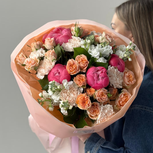 Bouquet with peonies, spray roses, carnations, and stock