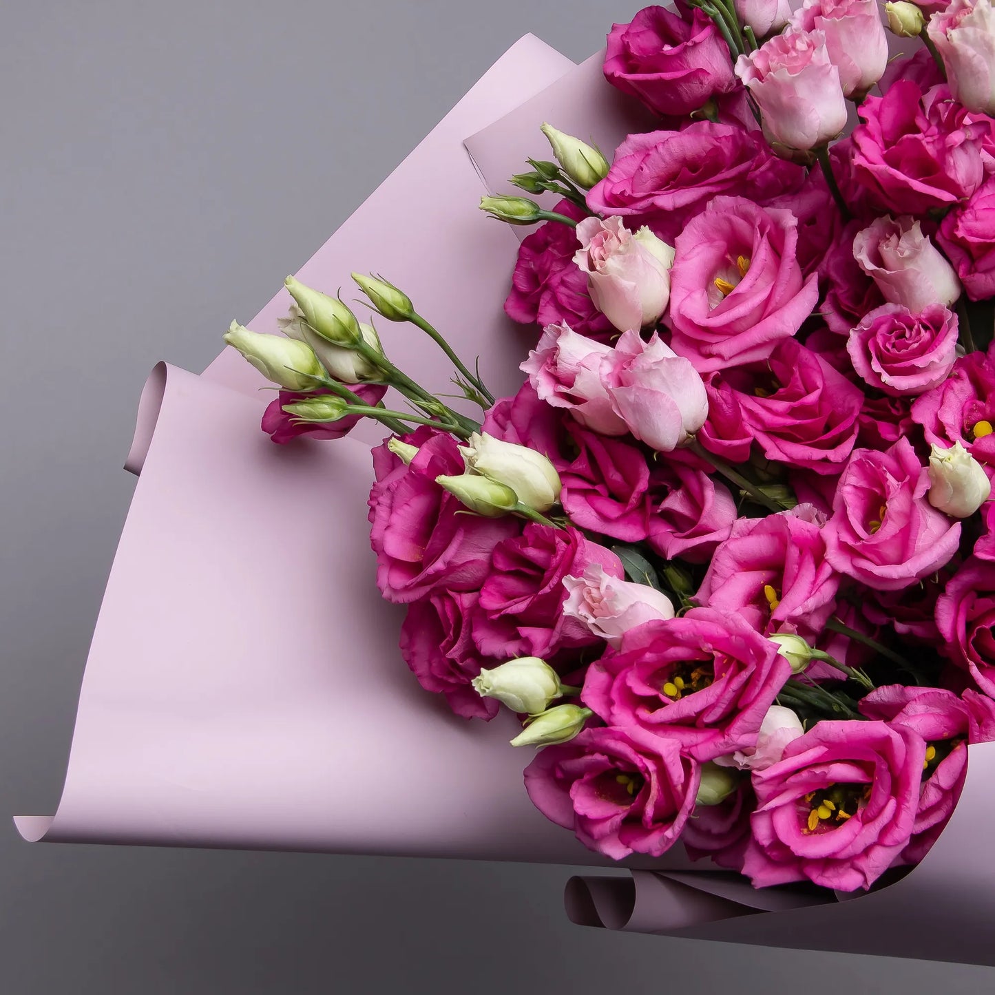 Close-up of pink lisianthus blooms in soft bouquet