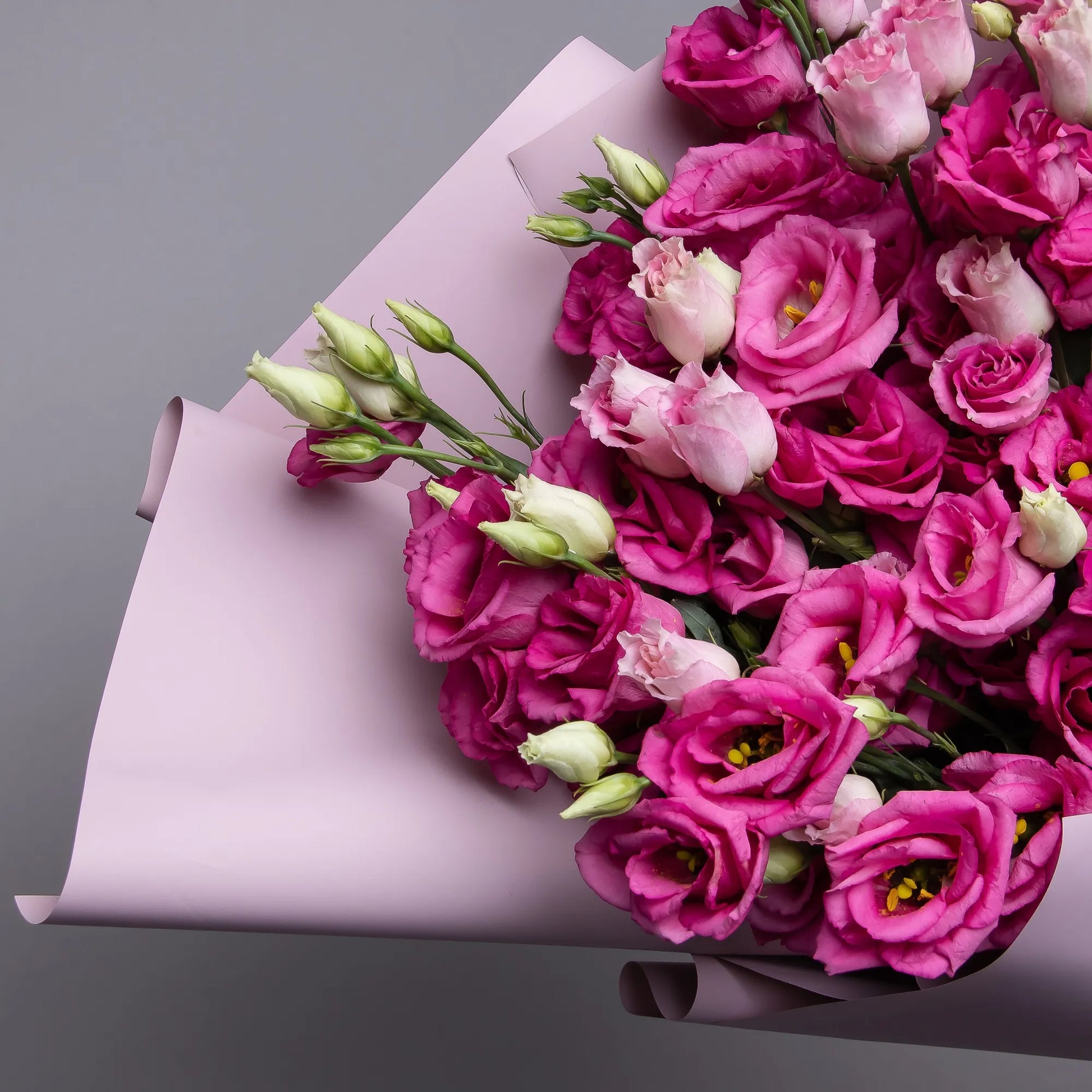 Close-up of pink lisianthus blooms in soft bouquet