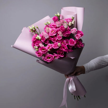 Bouquet of 12 pink lisianthus flowers with greenery