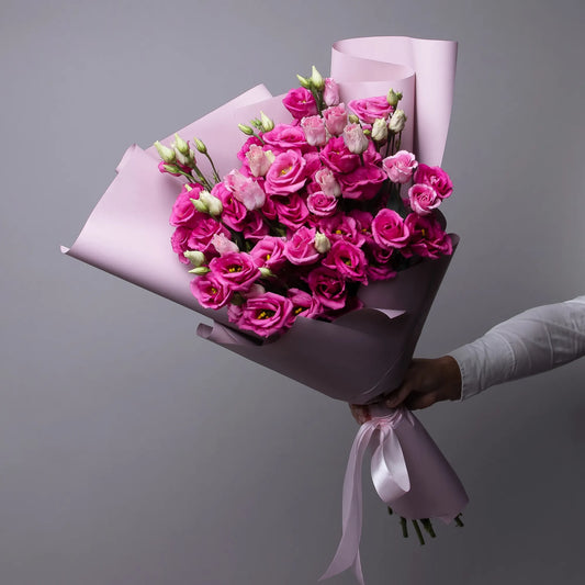 Bouquet of 12 pink lisianthus flowers with greenery