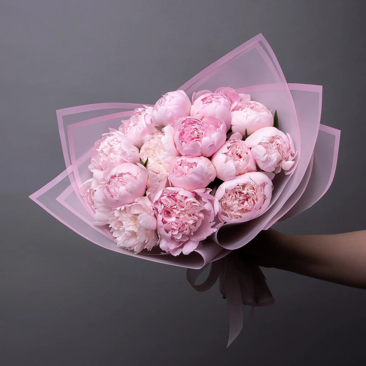 Bouquet of 18 pink peonies with greenery
