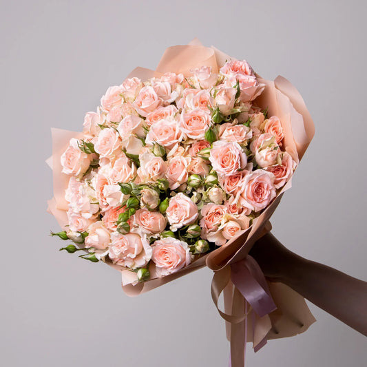 Bouquet of 24 pink spray roses with greenery