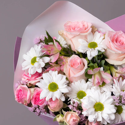 Close-up of gentle mixed flowers in compliment bouquet