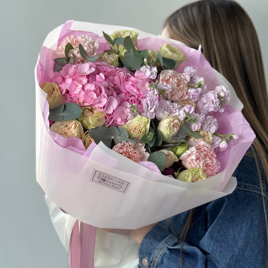 Soft bouquet with hydrangeas, spray roses, carnations, and stock