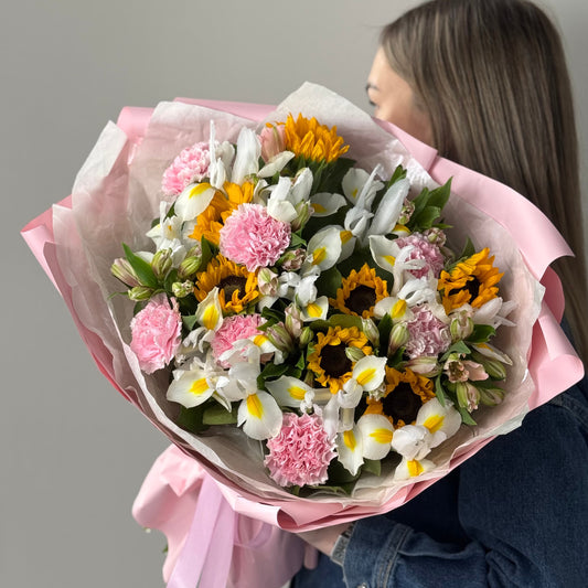 Bouquet with sunflowers, irises, carnations, and alstroemeria