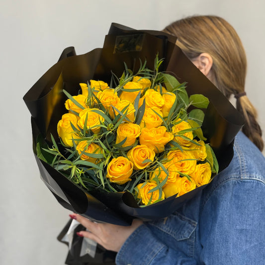 Bright bouquet of 24 roses with eucalyptus