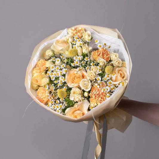 Bouquet with roses, chamomile, spray roses, and carnations
