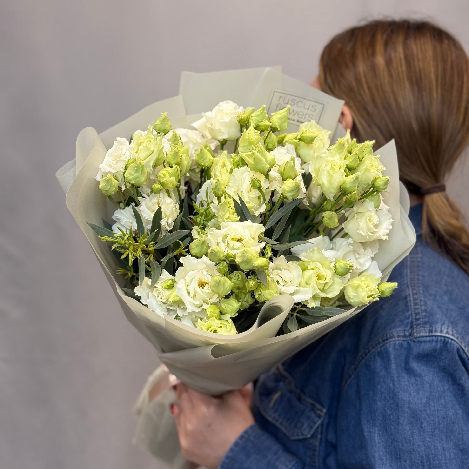White lisianthus bouquet with eucalyptus and fern greenery