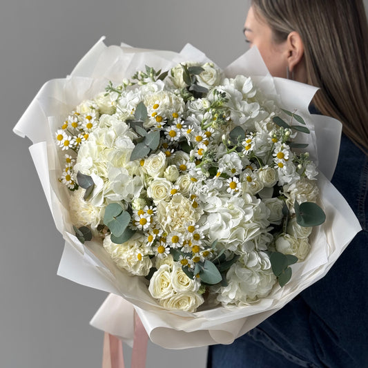 White bouquet with hydrangeas, chamomile, spray roses, stock, and carnations