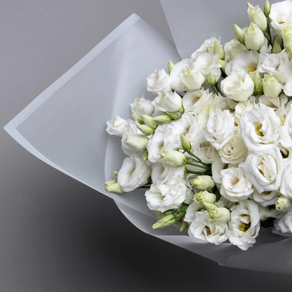 Close-up of white lisianthus flowers in elegant bouquet