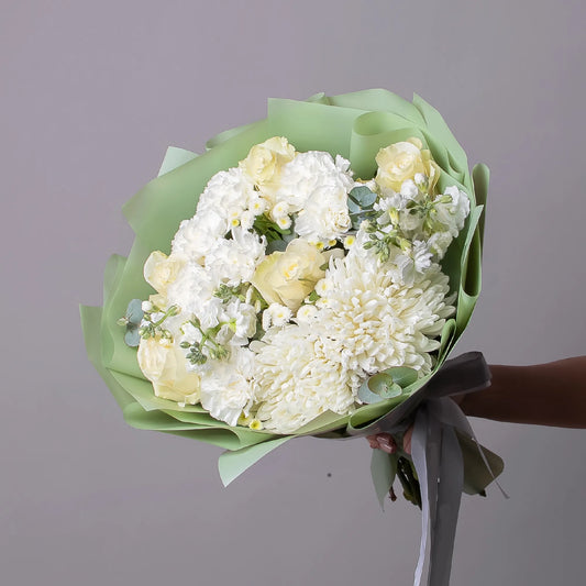 White bouquet with roses, stock, chrysanthemums, and chamomile