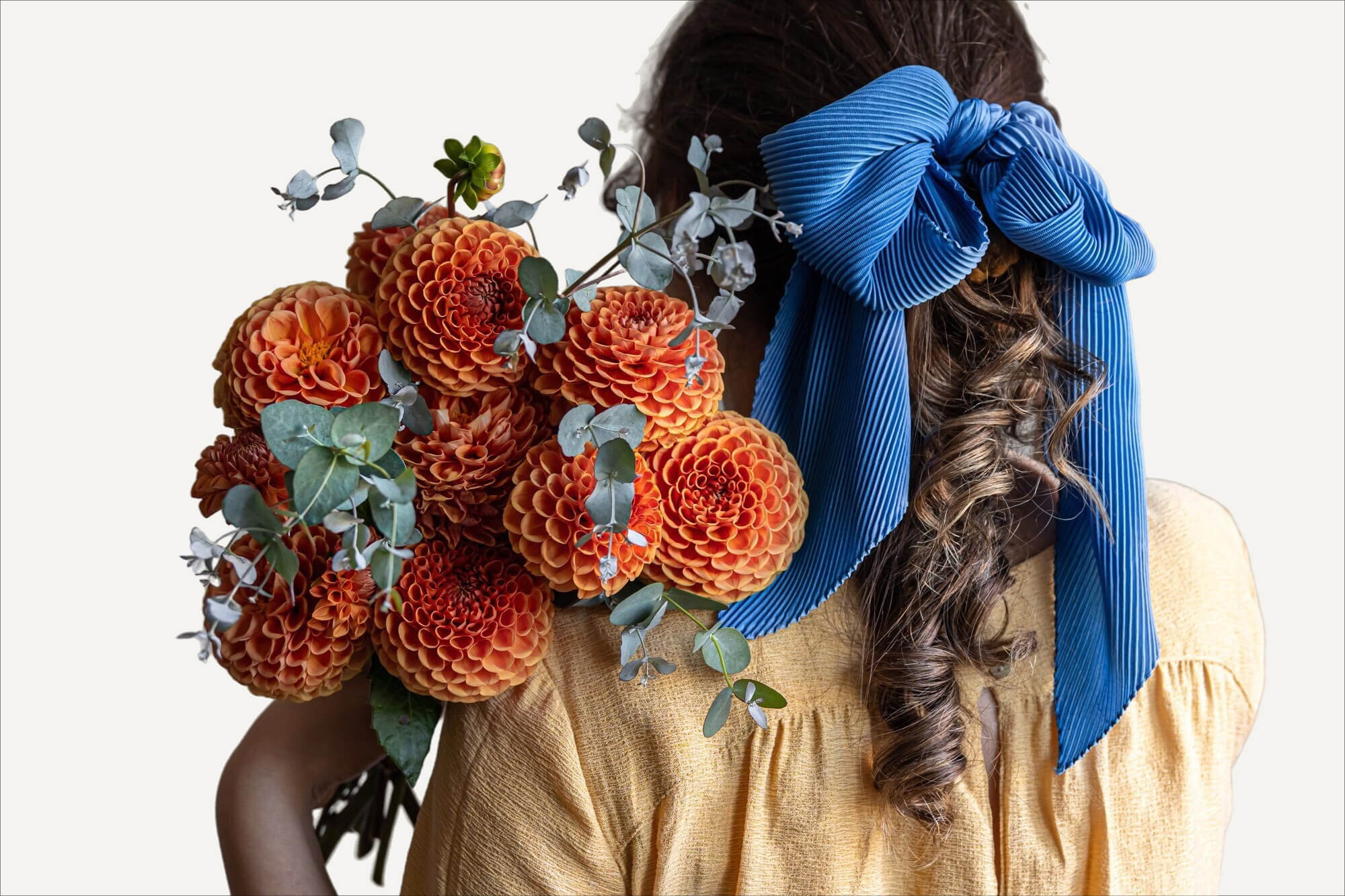 Woman holding dahlia bouquet – same-day flower delivery in NYC by Ruscus Flowers